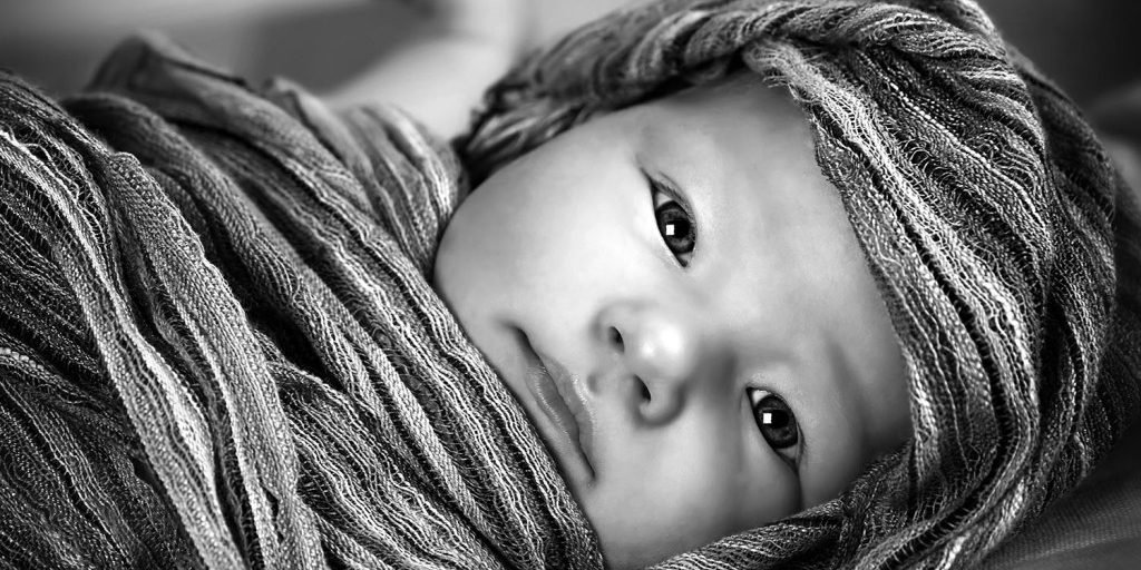 african-baby-wrapped-in-cloth-eyes-open-1500x-1024×997