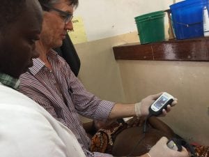Dr James with Portable Ultrasound Dr James with Portable Ultrasound